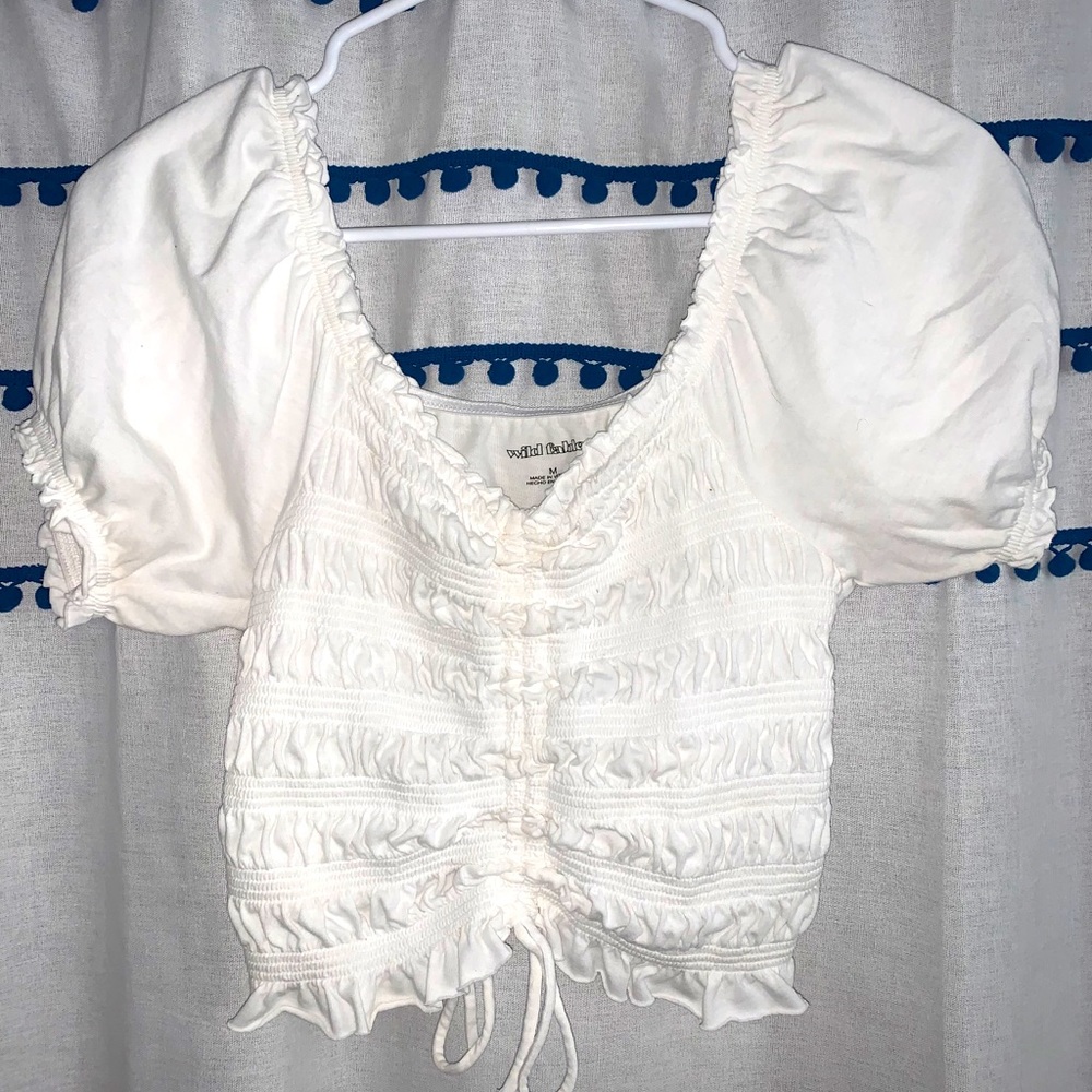 Super cute and trendy white ruffled top!!